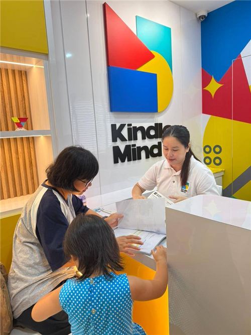 Parent and child at Kindle Mind reception
